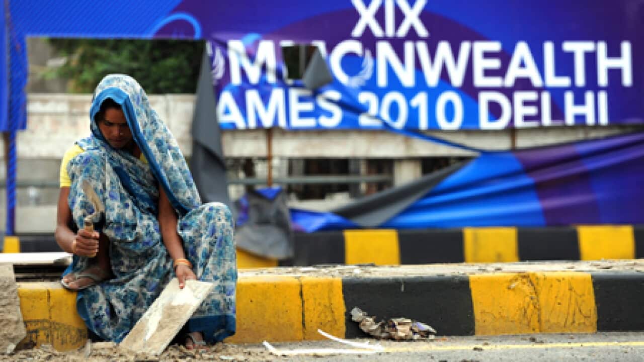 delhi_games_sign_woman_100924_B_getty_611847192