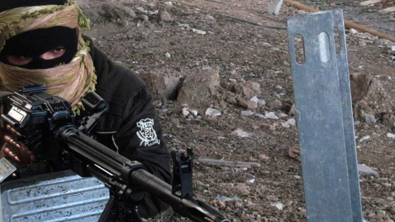 A Sunni fighter takes up position in Fallujah city, western Iraq