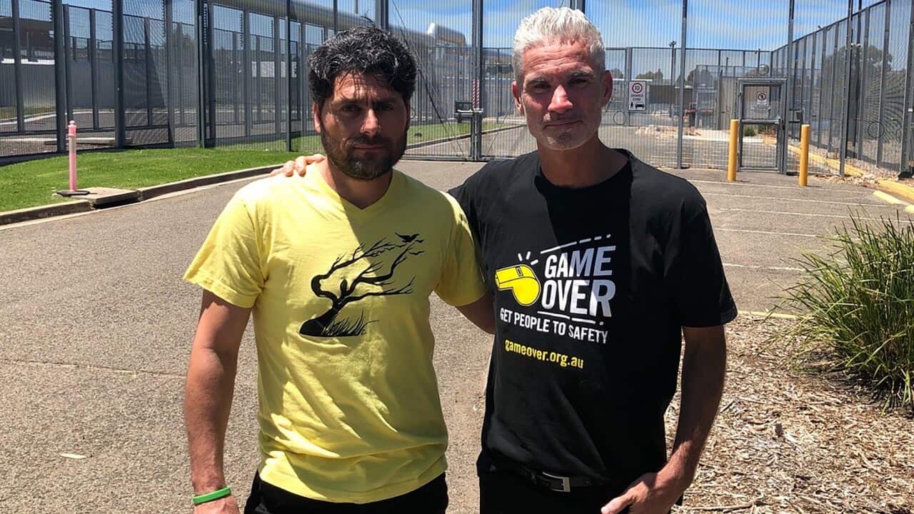 Refugee advocate Craig Foster with former immigration detainee Farhad Bandesh.