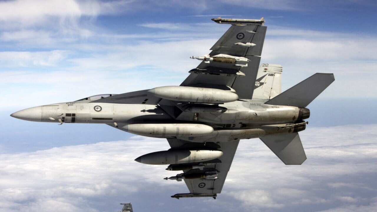 An RAAF FA-18F Super Hornet begins a mission in Iraq