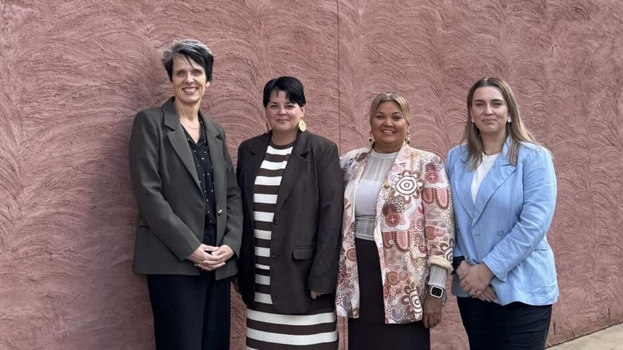 Karen Ingram and colleague Hope Cooper from Aboriginal and Torres Strait Islander Health Integrated Care at TAFE NSW in Griffith, pictured at the recent graduation ceremony for the Certificate III in Mentoring Aboriginal and Torres Strait Islander People, alongside fellow Marathon Health team members Bec Little and Justine Summers