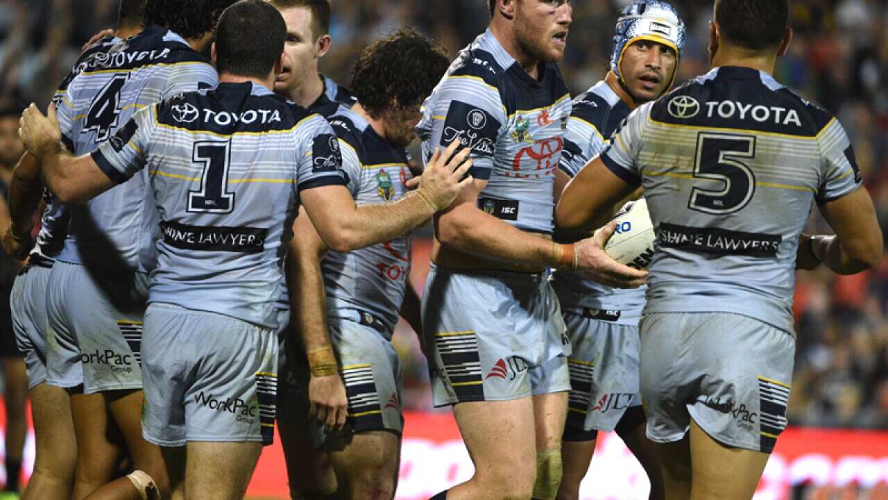 North Queensland players celebrate after scoring a goal
