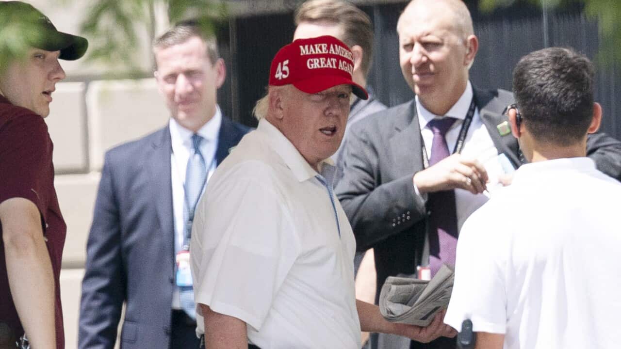 President Donald Trump arrives at the White House after playing golf at Trump National Golf Club.