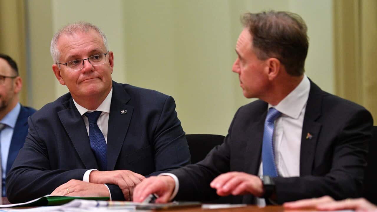Australian Prime Minister Scott Morrison (left) and the Australian Health Minister Greg Hunt are seen during a GP roundtable conference at the Commonwealth Parliamentary offices in Melbourne, Friday, March 19, 2021. (AAP Image/James Ross) NO ARCHIVING