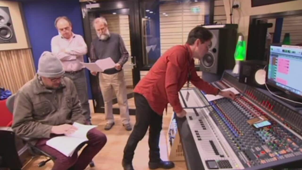 Tim Gray works with his mentors to produce a composition.