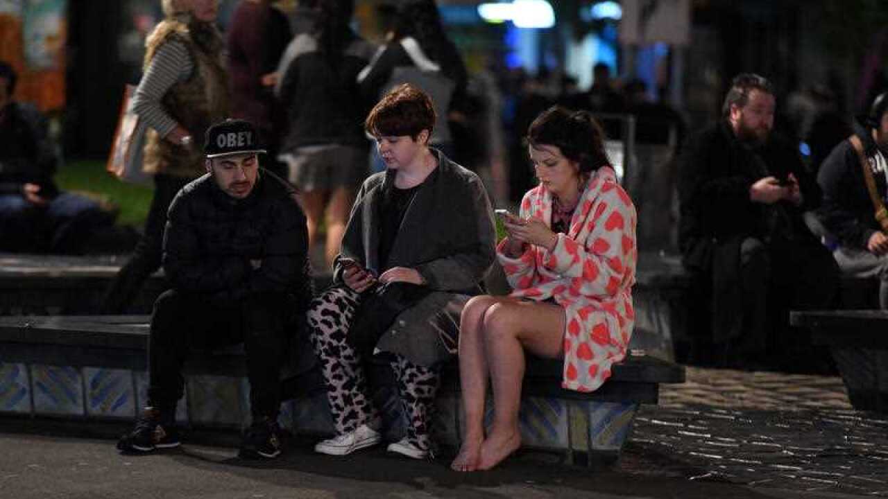 People evacuated from buildings along Dixon Street, Wellington after a 6.6 earthquake based around Cheviot in the South island shock the capital, New Zealand