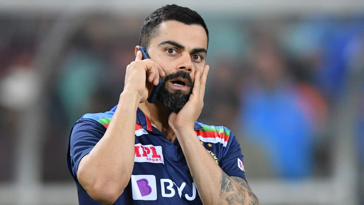 Virat Kohli of India is seen on the phone following the third T20 cricket match between Australia and India at the SCG, Sydney, Tuesday, December 8, 2020.