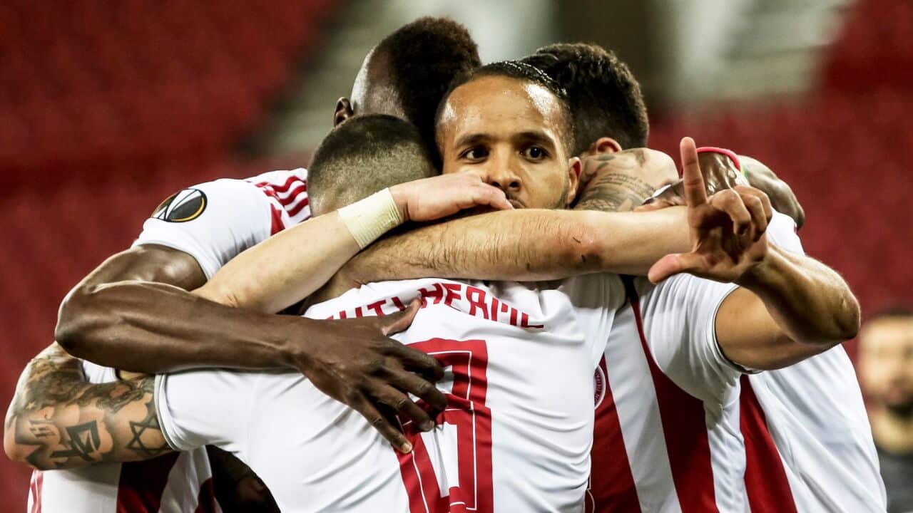 Olympiacos’s Youssef El-Arabi (C) celebrates with team mates after scoring the 1-0 during the UEFA Europa League Round of 16 first leg soccer match.