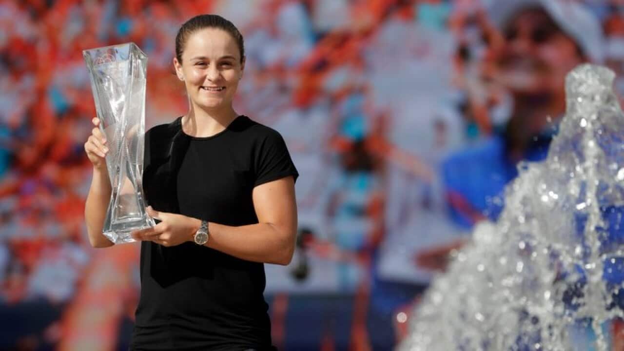 Ash Barty poses with the trophy after defeating Carolina Pliskova at the Miami Open