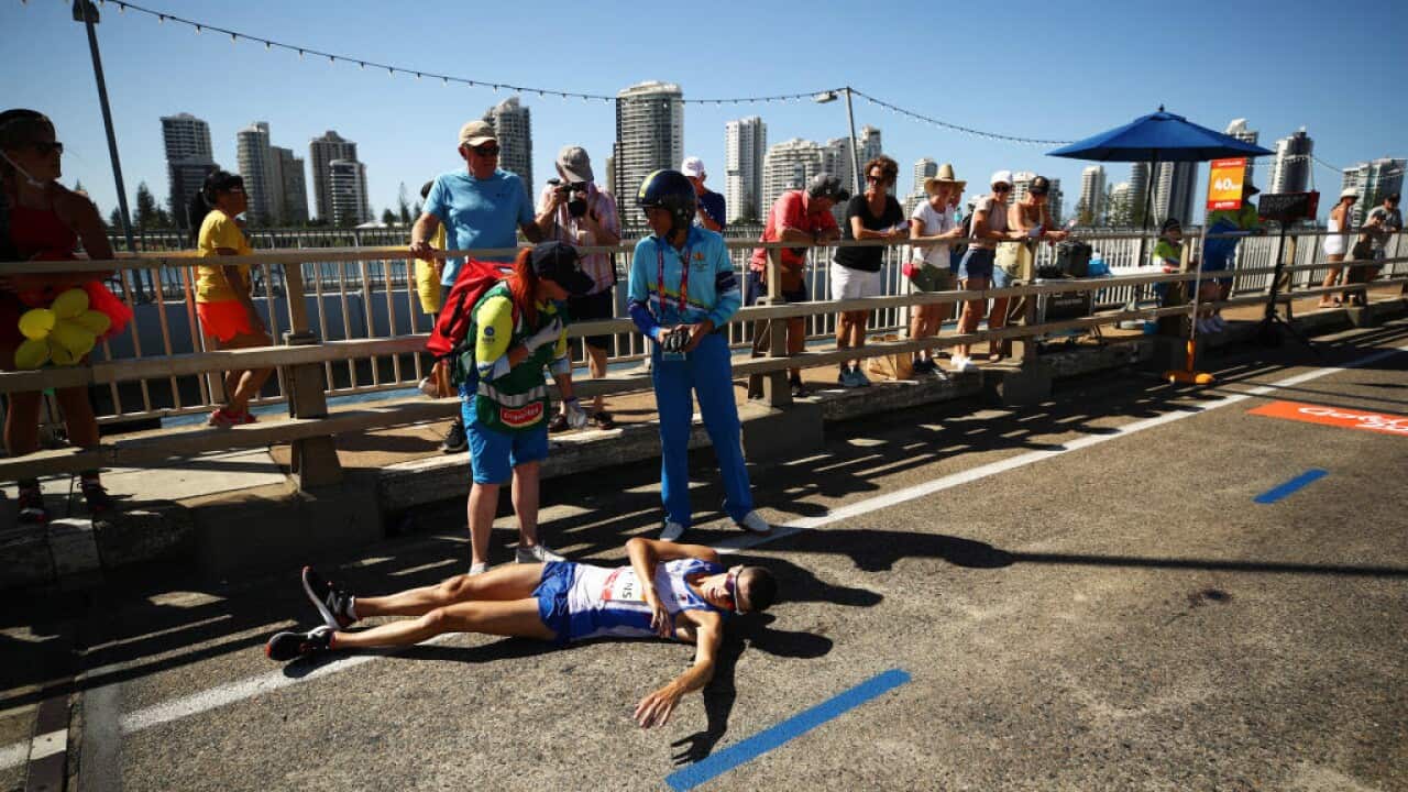 Callum Hawkins of Scotland collapses as he competes in the Men's marathon on day 11 of the Gold Coast 2018 Commonwealth Games.