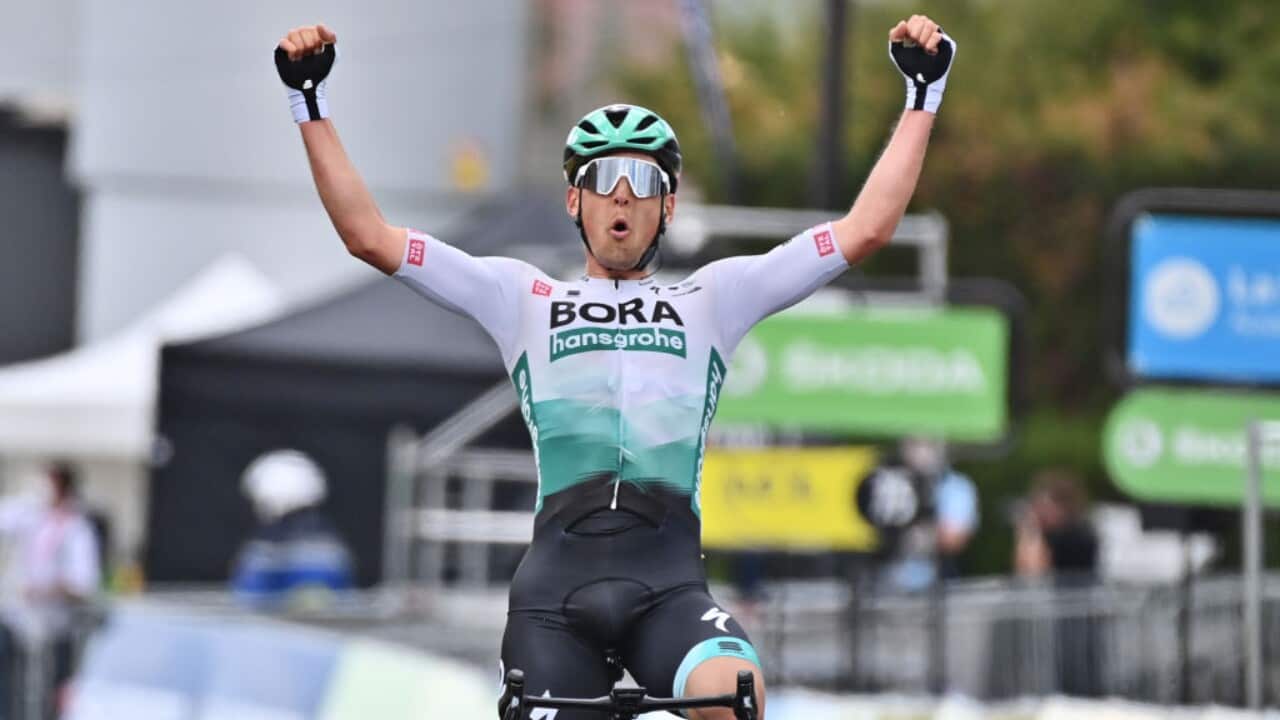 Lukas Postlberger of Bora-Hansgrohe celebrates his stage two victory at the Criterium du Dauphine