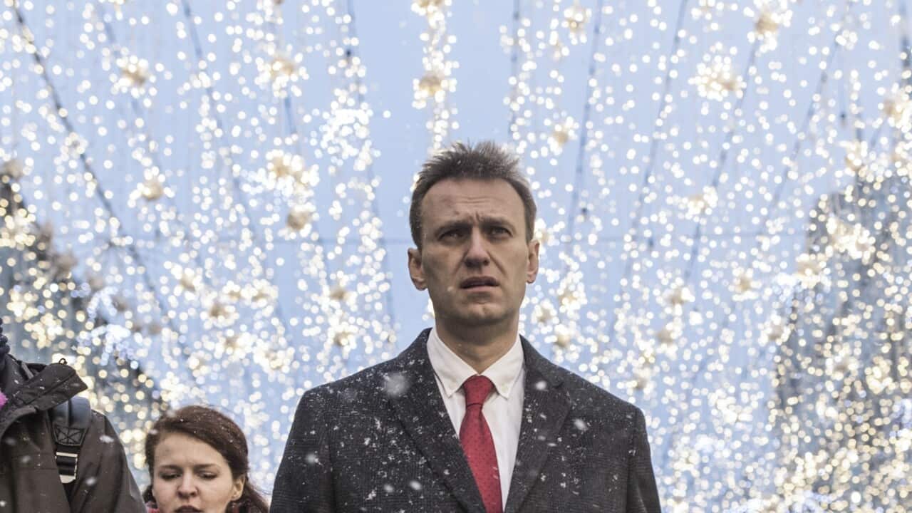 Russian opposition leader Alexei Navalny, centre, is in an intensive care unit in Siberia after falling ill from suspected poisoning.