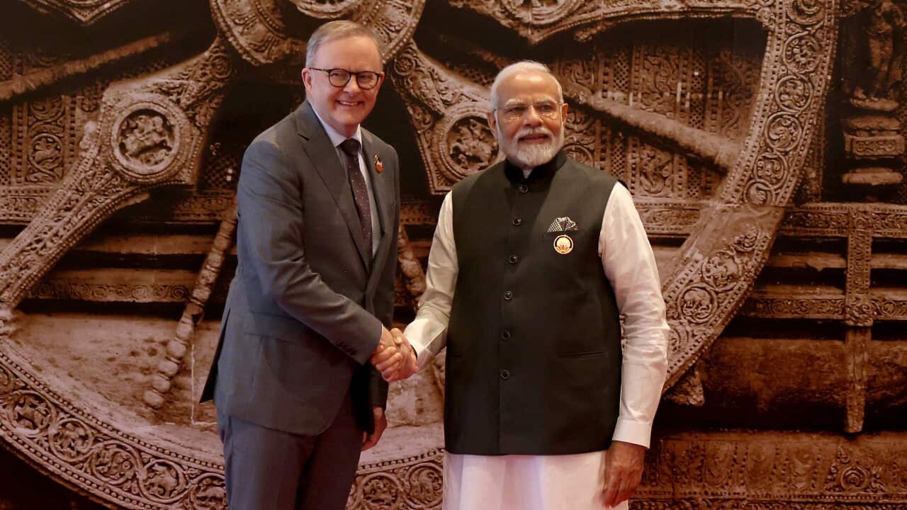 Anthony Albanese in a suit with Indian PM Narendra Modi in traditional wear