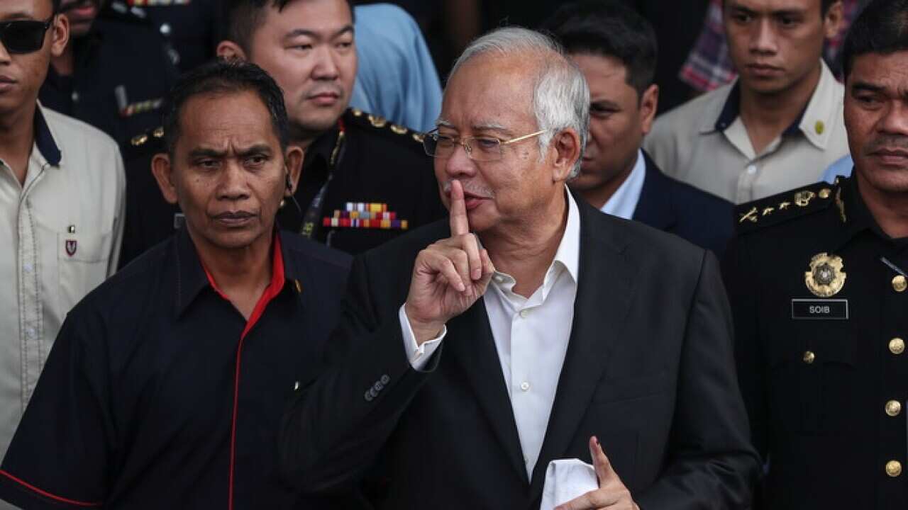 Former Malaysia prime minister Najib Razak leaves the Malaysian Anti-Corruption Commission headquarters in Putrajaya