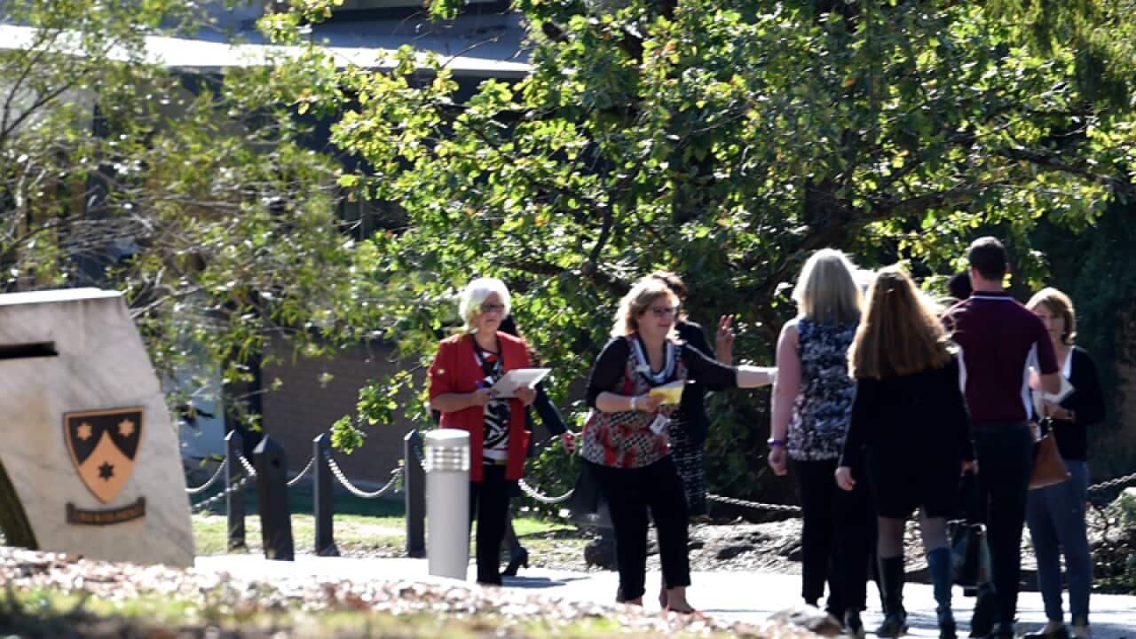 Mourners arrive at the funeral for Patrick Cronin