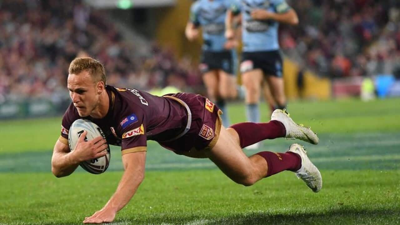 Daly Cherry-Evans of the Maroons scores a try during Origin Game III.