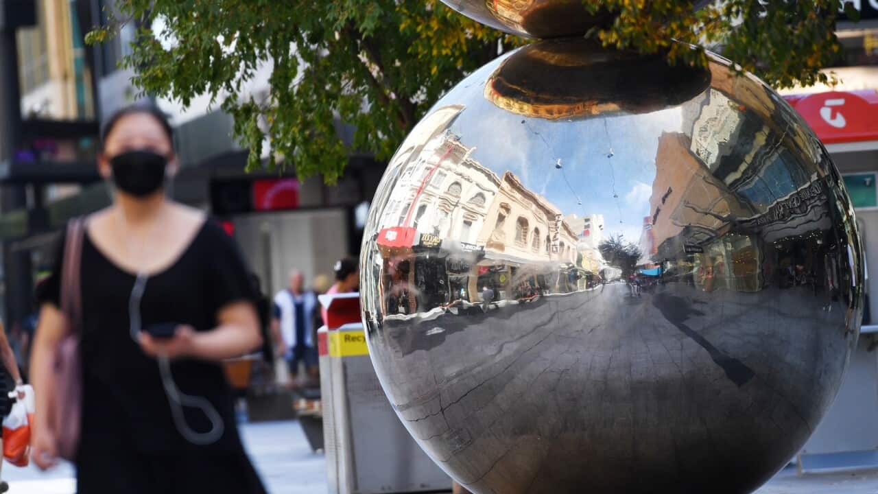 People are seen walking through Rundle Mall in Adelaide, Saturday, March 28, 2020 Rundle Mall is normally one of South Australia's busiest shopping districts. (AAP Image/David Mariuz) NO ARCHIVING