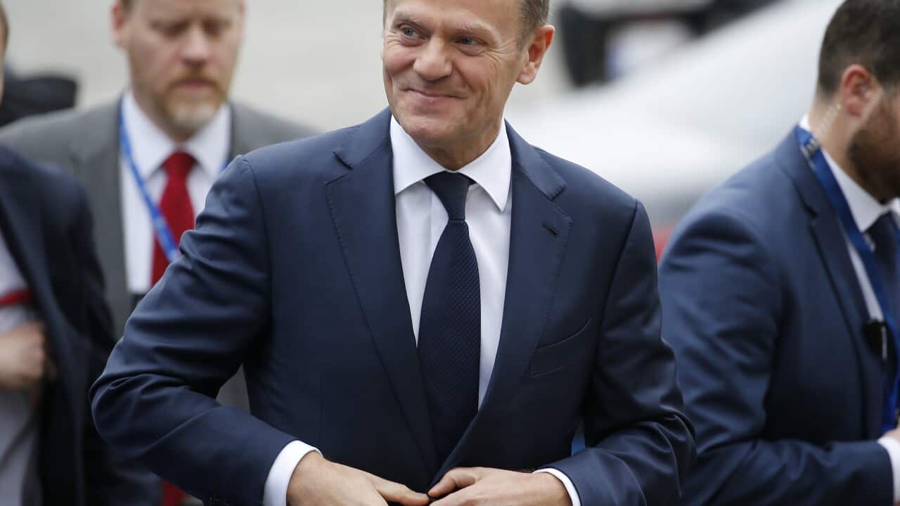 EU Council President Donald Tusk (C) arrives for an European People's Party (EPP) leaders meeting