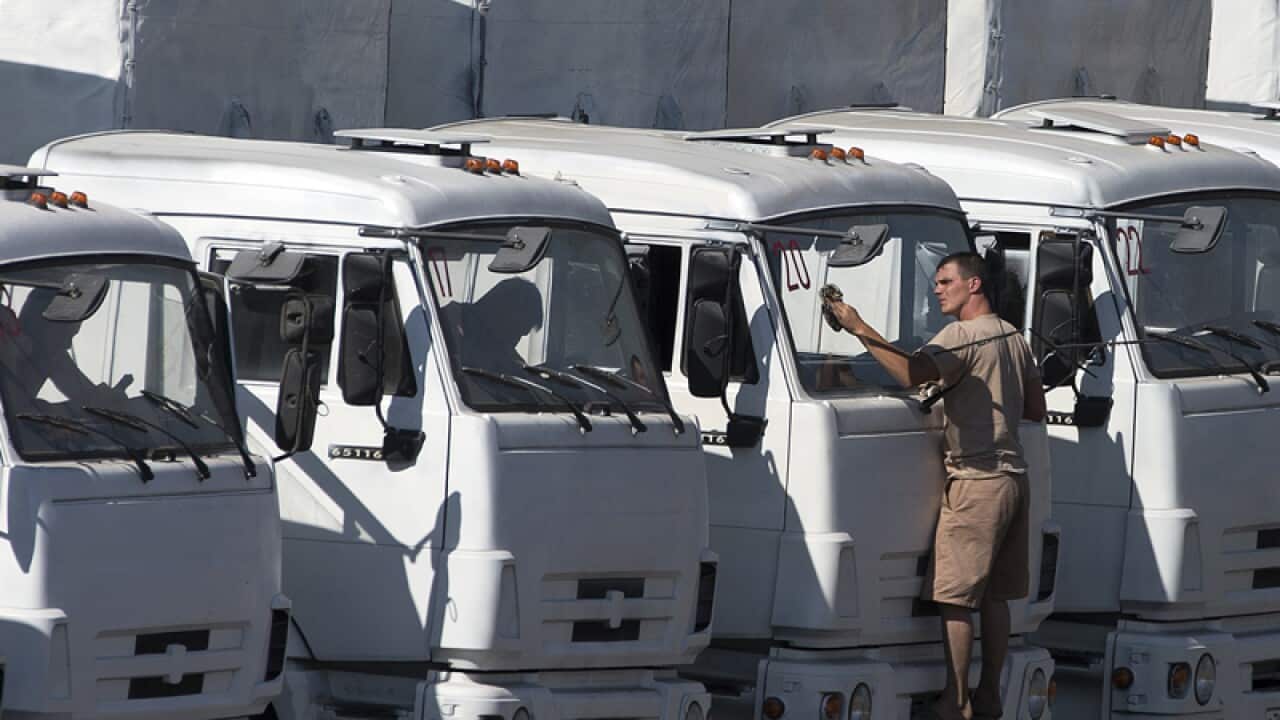 A driver washes the windshield