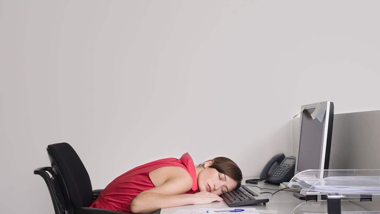 Woman asleep at desk