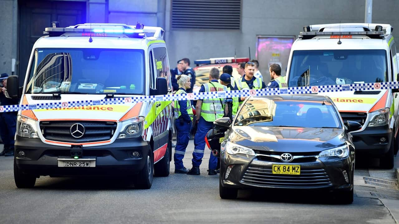 Ambulances and police cars at the scene.