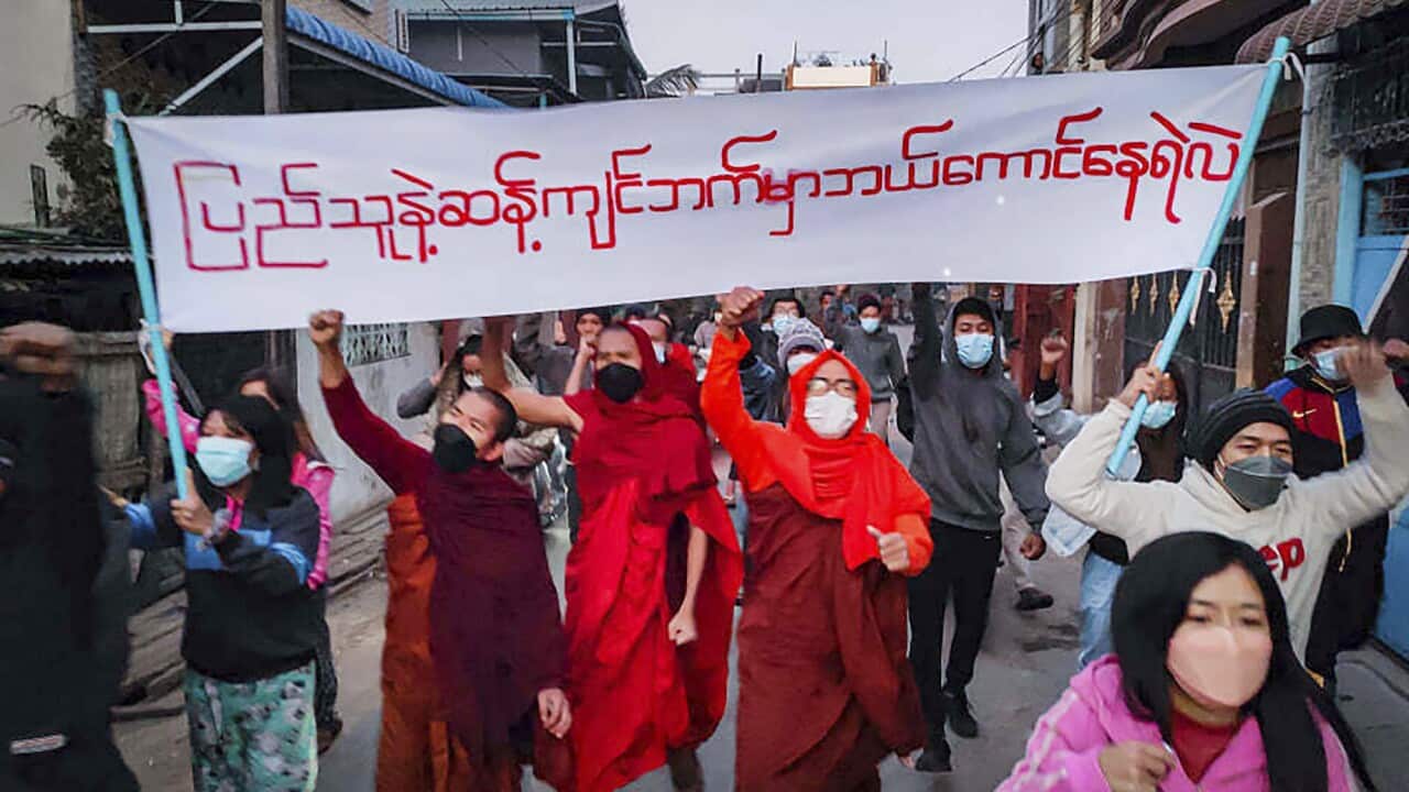 Youth activists and Buddhist monks participate in an anti-military government protest rally in Mandalay, Myanmar.