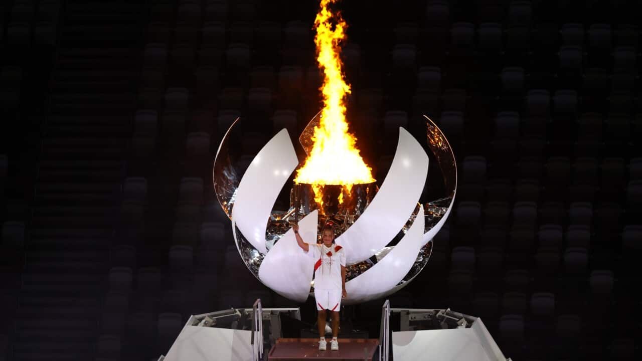 TOKYO, JAPAN - JULY 23: Tennis player Naomi Osaka light the Olympic torch during the Opening Ceremony of the Tokyo 2020 Olympic Games at Olympic Stadium on July 23, 2021 in Tokyo, Japan.