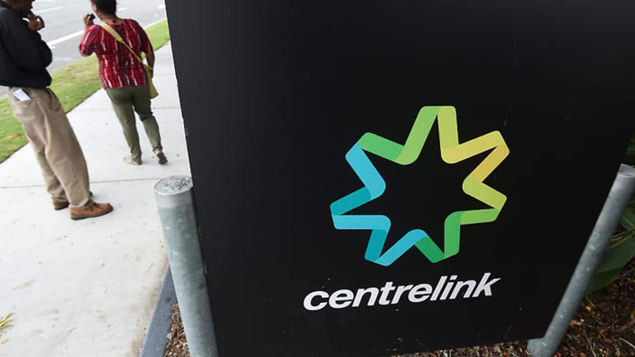 People stand outside a Centrelink office in Brisbane, Monday, March 21, 2016. Public Servants at Federal Governments department have begun striking nationwide after failed pay negotiations. (AAP Image/Dan Peled) NO ARCHIVING