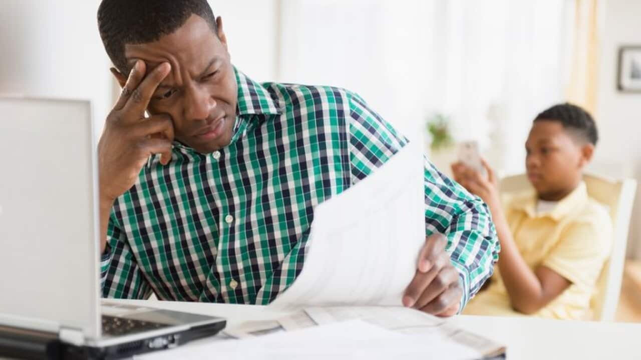 Father paying taxes online