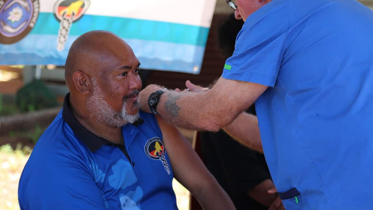Senior Aboriginal Practitioner at WA's Beagle Bay clinic, Vaughan Matsumoto receives a coronavirus vaccine