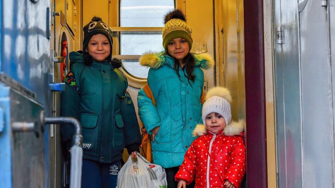 Children board a train that is evacuating residents from Kramatorsk.
