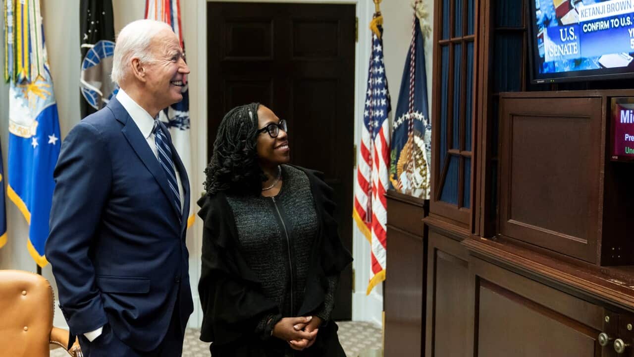 U.S. President Joe Biden and Supreme Court nominee Ketanji Brown Jackson watch as the Senate votes to confirm her appointment.