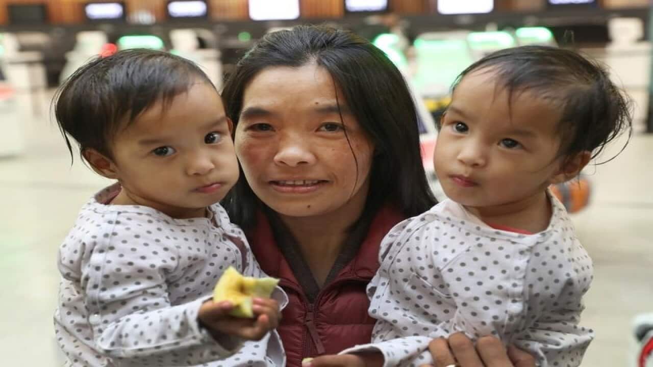 Formerly conjoined twins Nima and Dawa, and their mother Bhumchu.