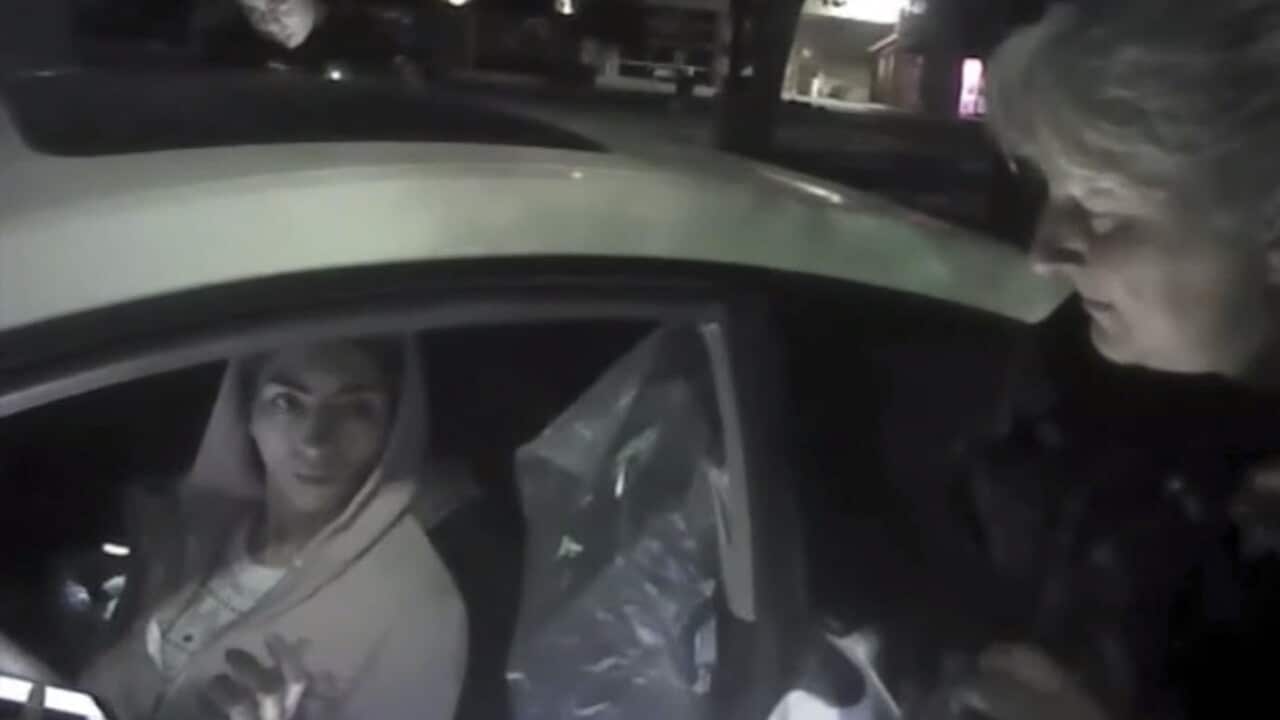 In this April 3, 2018 image from video provided by the Mountain View Police, Nasim Aghdam is questioned by officers after being found asleep in her car.
