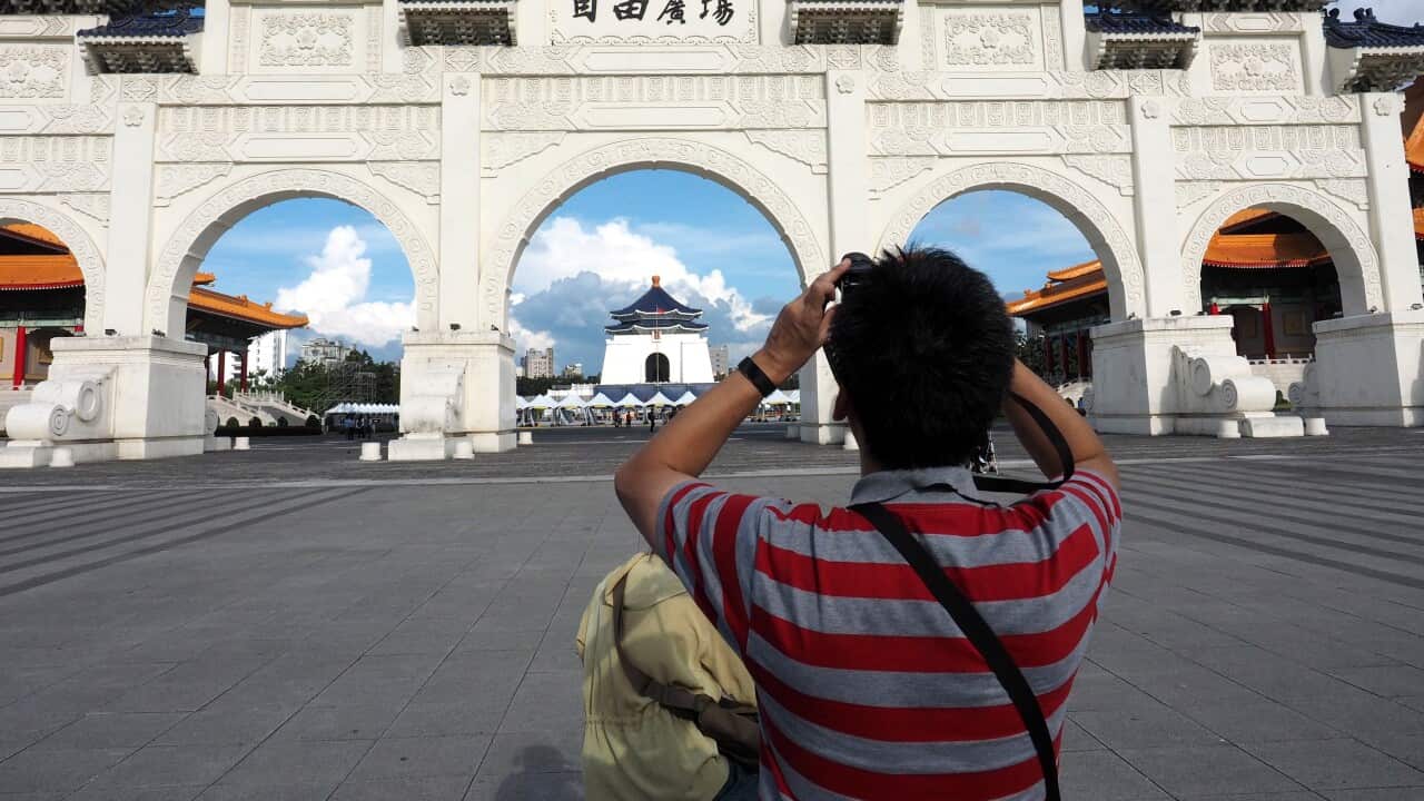 A tourist take photo at the Liberty Square in Taipei, Taiwan.