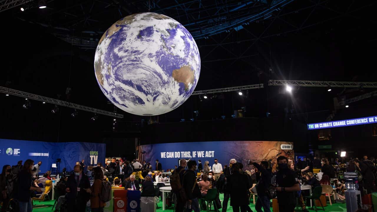 Attendees in the Blue Zone during the COP26 climate talks in Glasgow, Britain, 2 November 2021.
