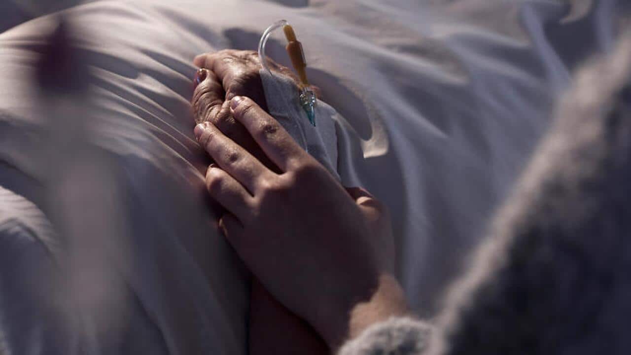 Woman supporting mother with cancer