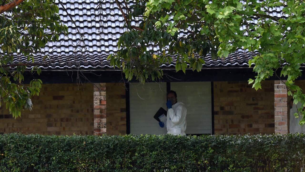 Forensic police are seen at a house in Davidson, in Sydney's north