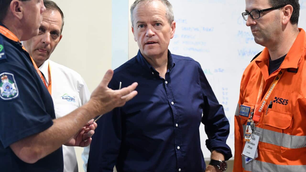 Bill Shorten (C) during a visit to Rockhampton