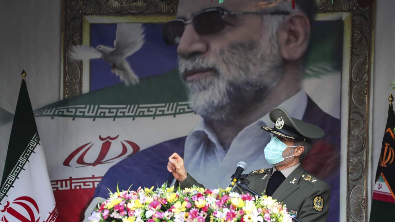 Defense Minister Gen. Amir Hatami speaks during a funeral ceremony for Mohsen Fakhrizadeh.