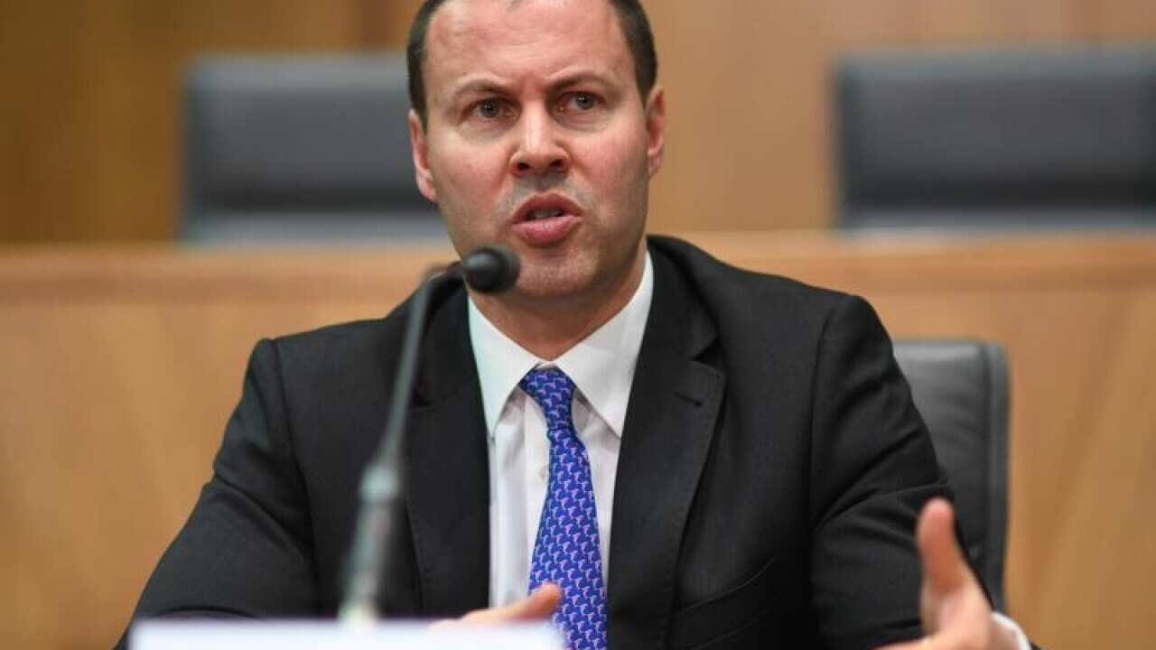 Josh Frydenberg speaks to the media during a press conference.