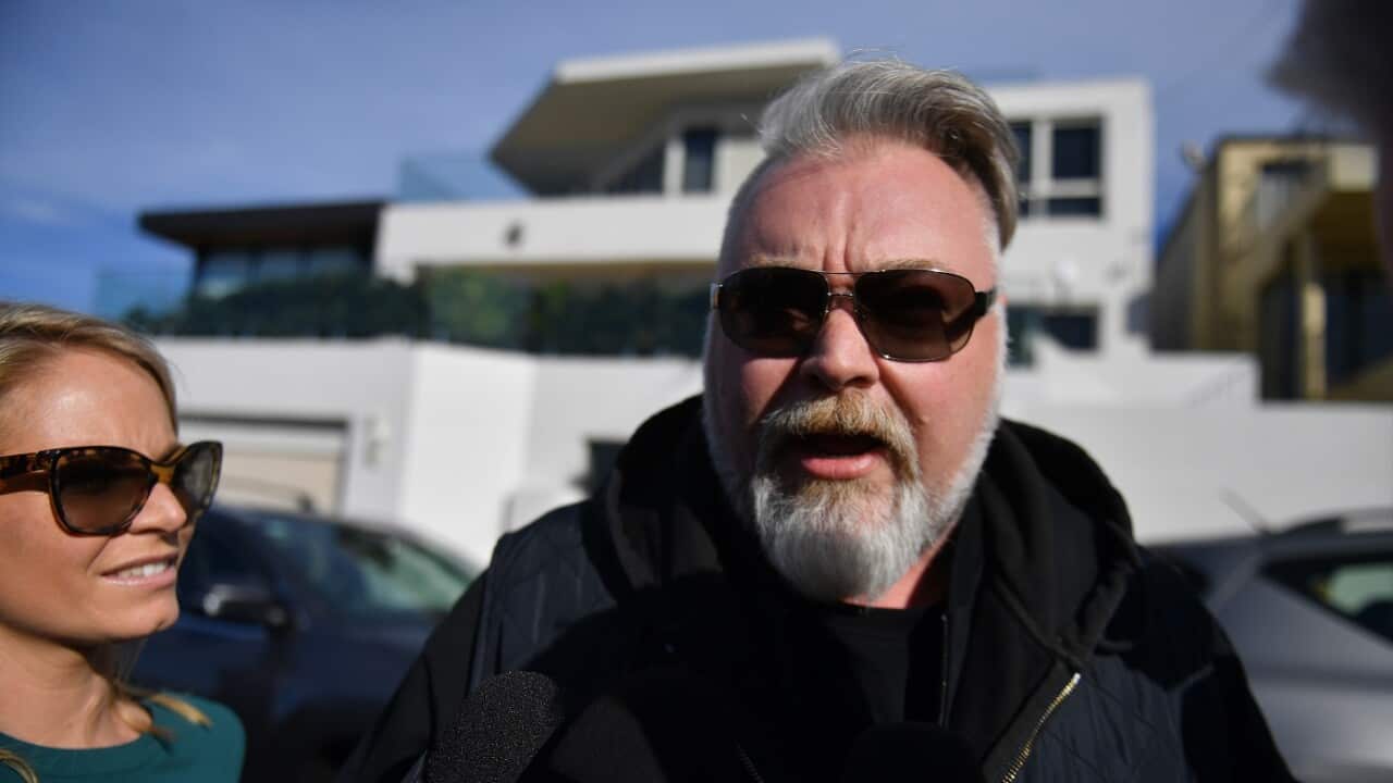 Radio host Kyle Sandilands arrives at the house of Kings Cross nightclub owner John Ibrahim during a police operation at Dover Heights in Sydney, Tuesday, July 31, 2018. (AAP Image/Mick Tsikas) NO ARCHIVING