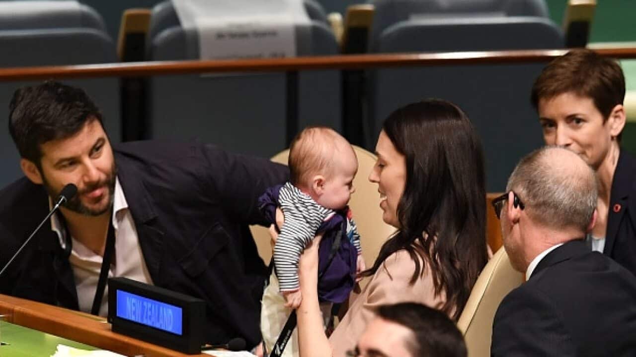 New Zealand Jacinda Ardern holds her daughter Neve after giving her address.