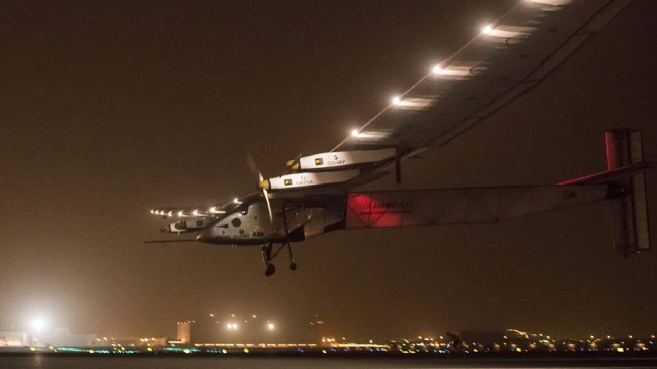 The Solar Impulse 2 plane approaches to land on the airport in Muscat