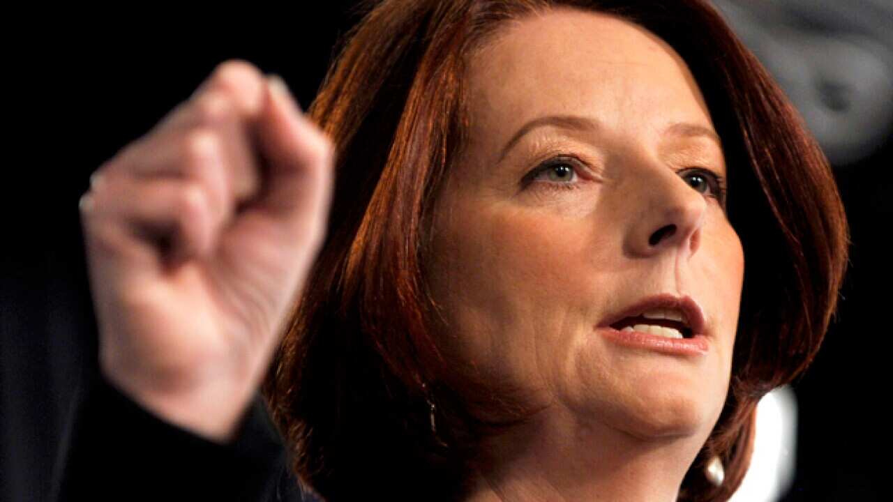 gillard_fist_110128_B_aap_531973833