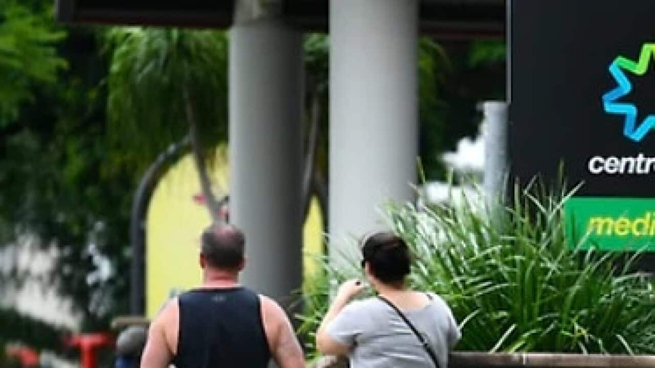 Australians wait outside a Centrelink office (FILE)