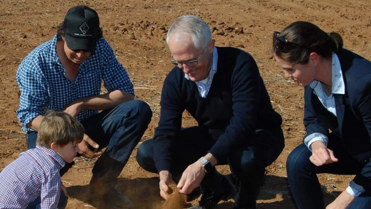 Malcolm Turnbull, farmer Phillip Miles, his wife Ashley