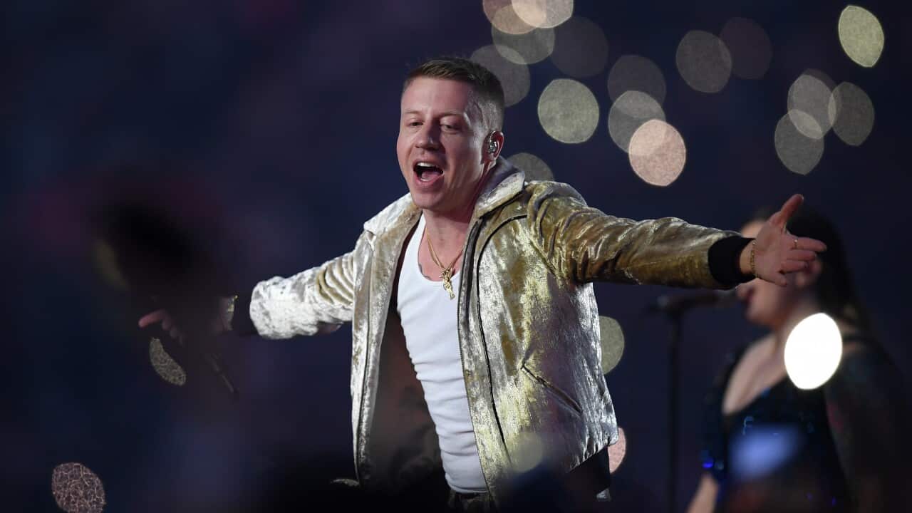 Macklemore performs during the NRL grand final between the Melbourne Storm and the North Queensland Cowboys.