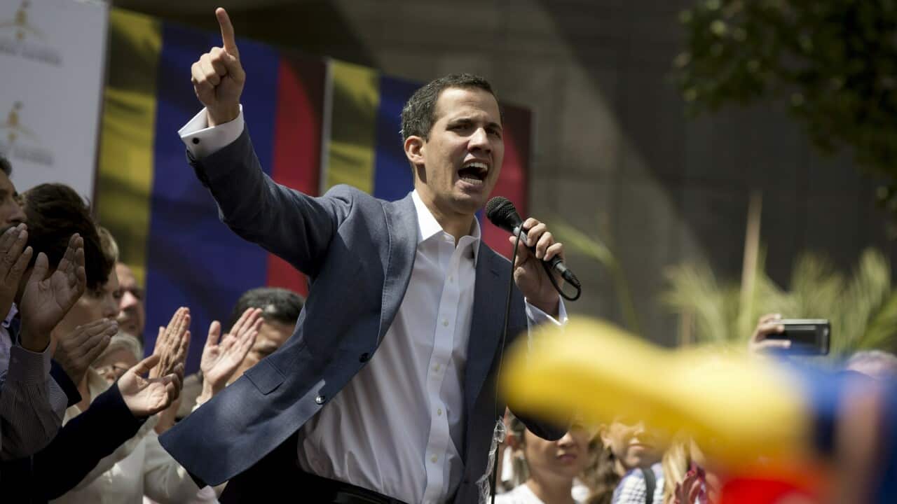 President of the Venezuelan National Assembly Juan Guaido delivers a speech during a public session with opposition members.