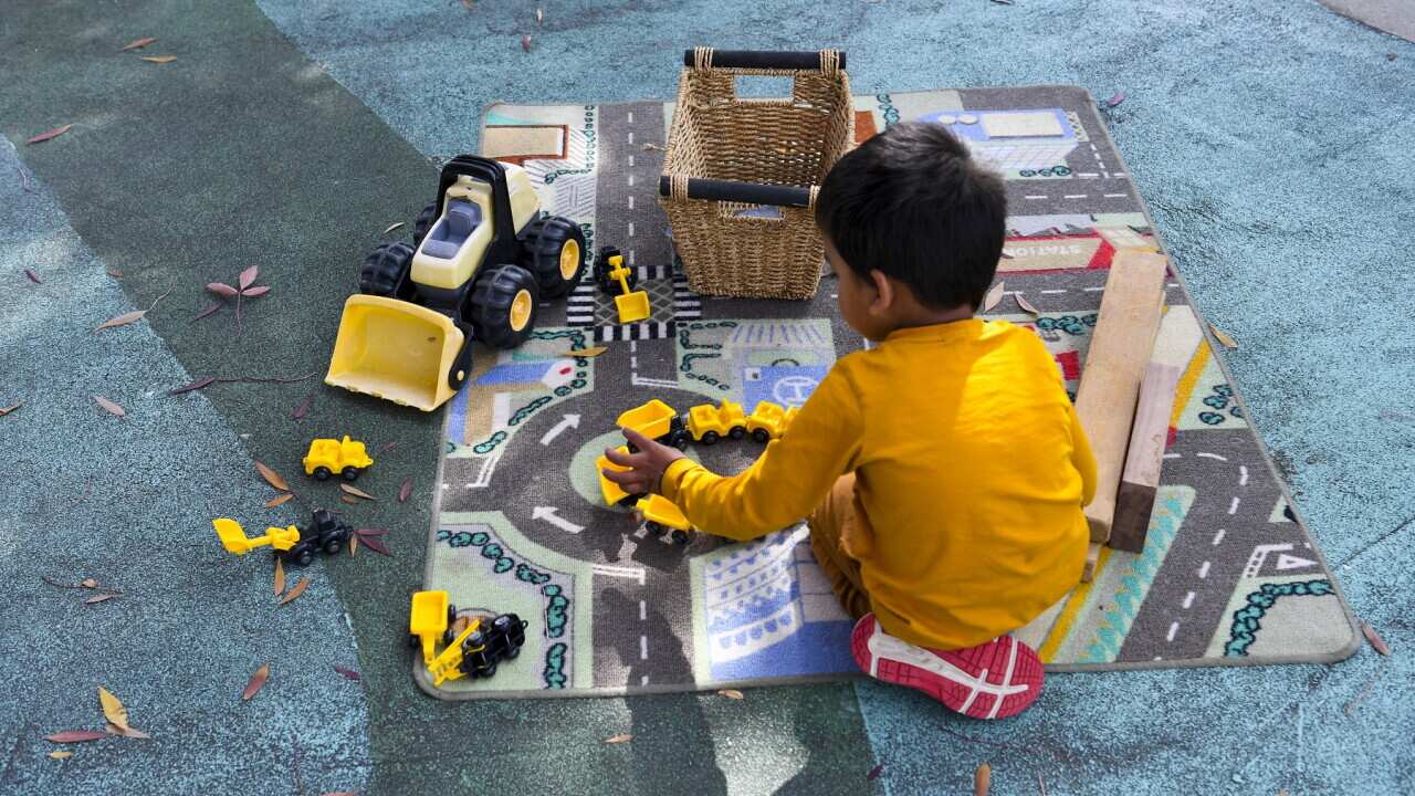 A child plays with toys at Narrabundah Cottage Childcare Centre in Canberra, Sunday, May 2, 2021. (AAP Image/Lukas Coch) NO ARCHIVING